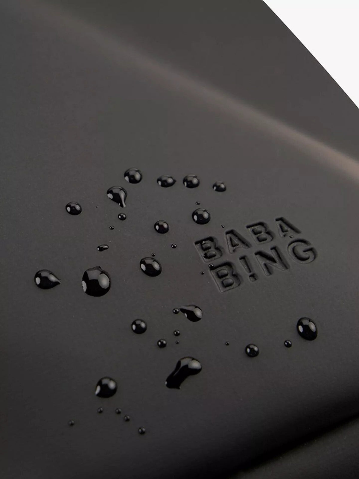 Water beading on the wipe-clean surface of the BabaBing! Sorm bag