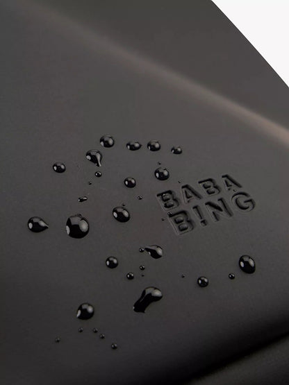 Water beading on the wipe-clean surface of the BabaBing! Sorm bag