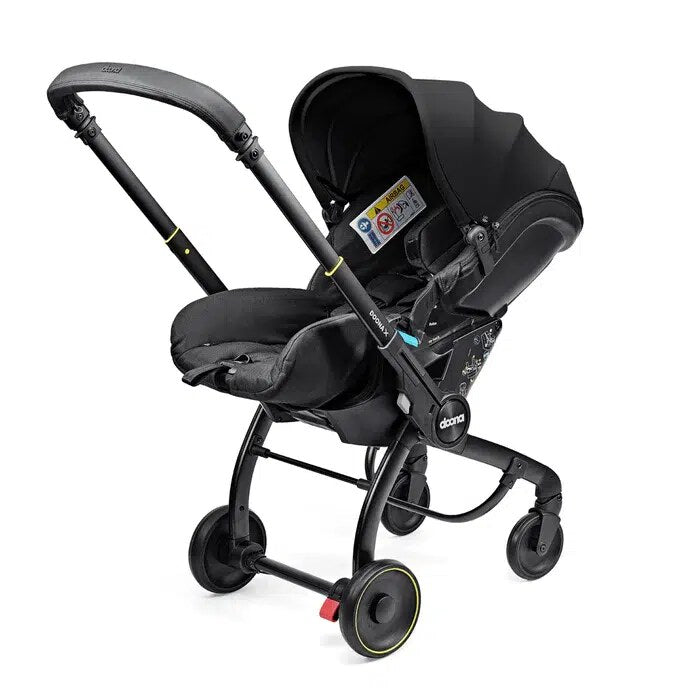 Doona X infant car seat and stroller in Nitro Black, side view